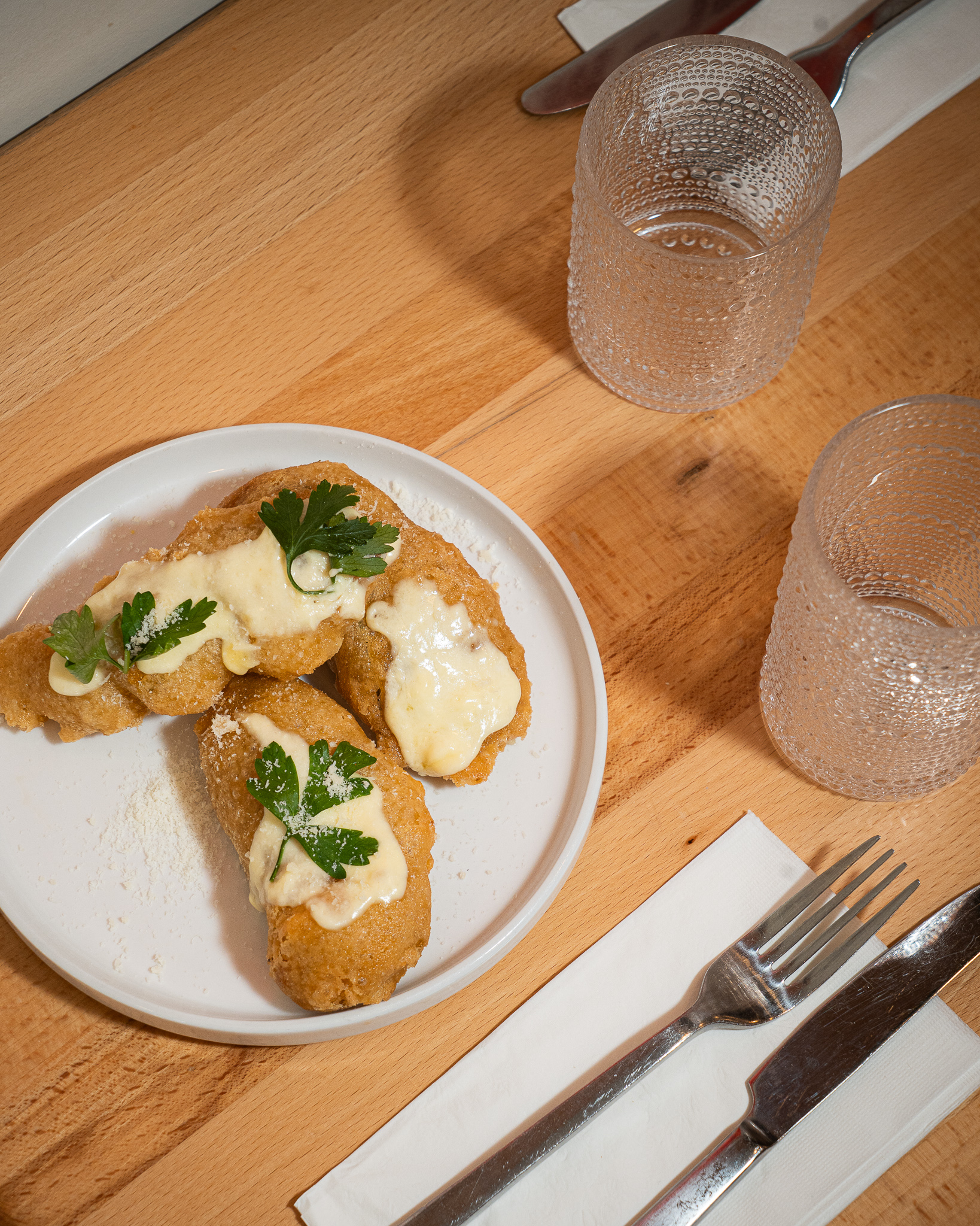Fiori di zucca cacio e pepe and Italian table spread in Hell's Kitchen